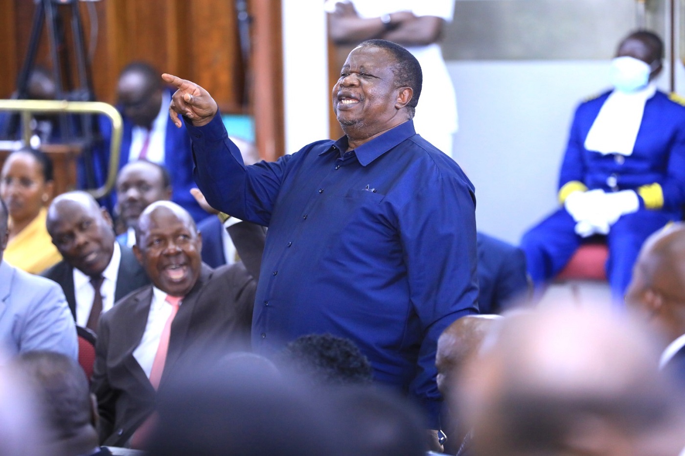 Internal Affairs minister, Hon. Kahinda Otaffire, addressing concerns raised by Hon. Nsereko on the type of clothing that the Bill seeks to consider military attire