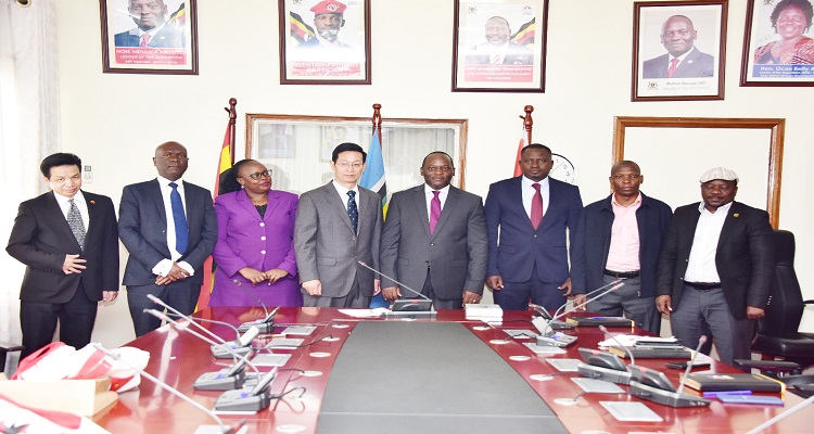 Hon. Mpuuga and Zhang Lizhong (C) with Opposition MPs and officiala from the Chinese Embassy after the meeting